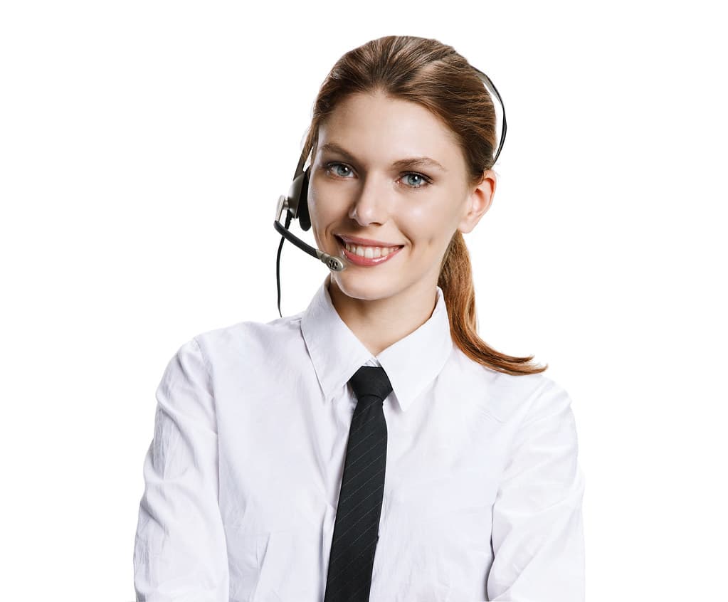 Office desk with a phone and laptop showing call management software